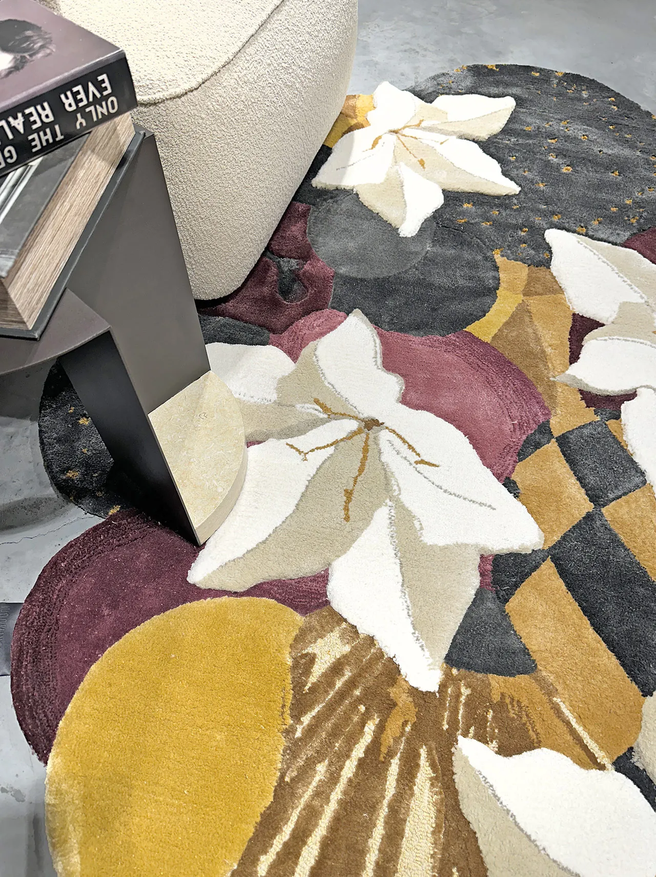 Colorful round floral-patterned rug with white flowers, yellow, purple